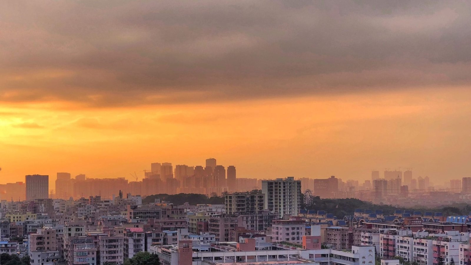 amazing-view-cityscape-with-cloudy-orange-sunset-sky (1)